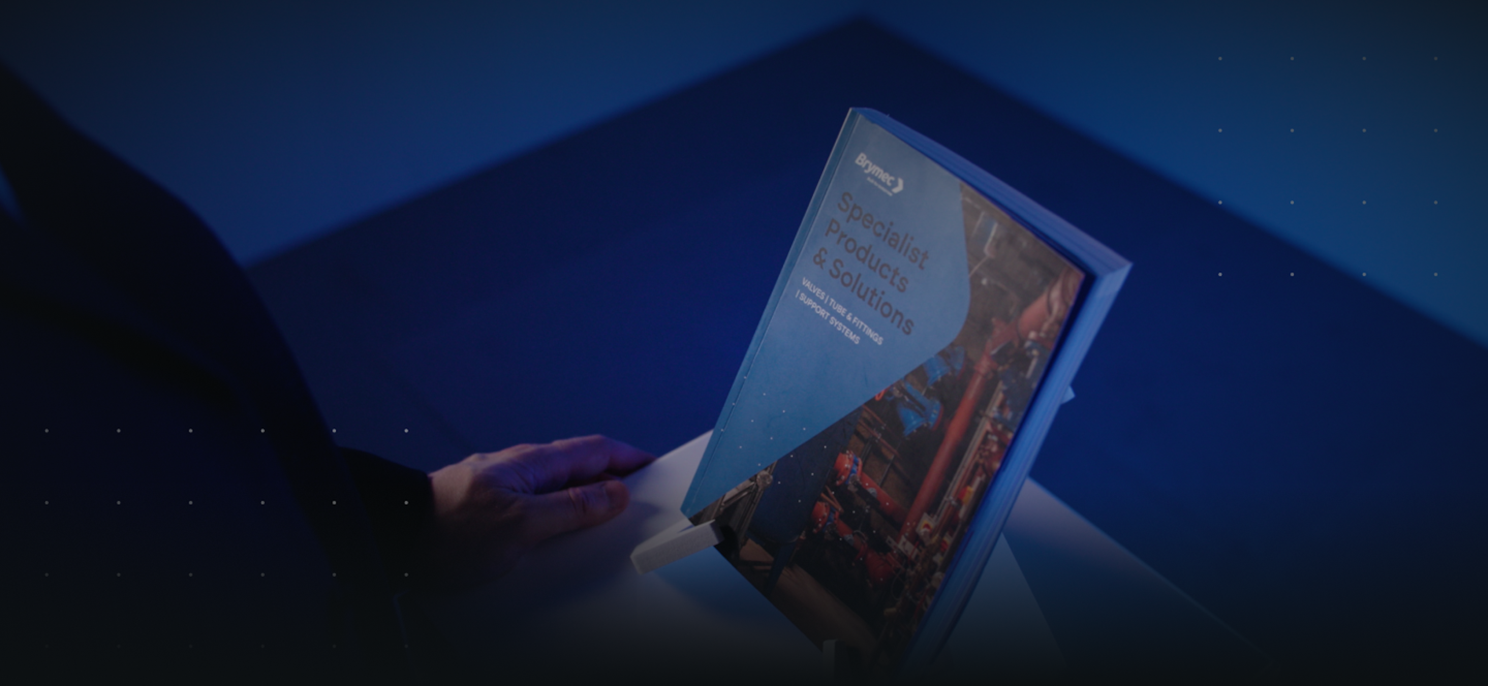 brymec catalogue on stand with hands reaching for it